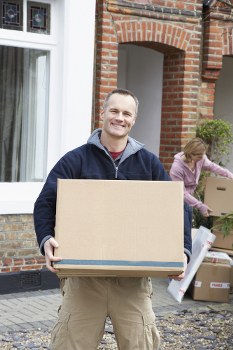 Moving boxes and furniture being loaded for a Harringay home removal