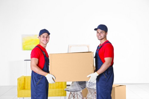 Furniture removals team handling a sofa move in Harringay