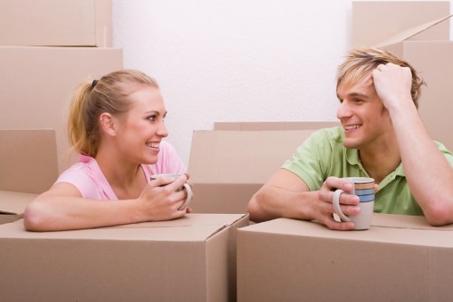 Student removals team handling boxes in a Harringay street move