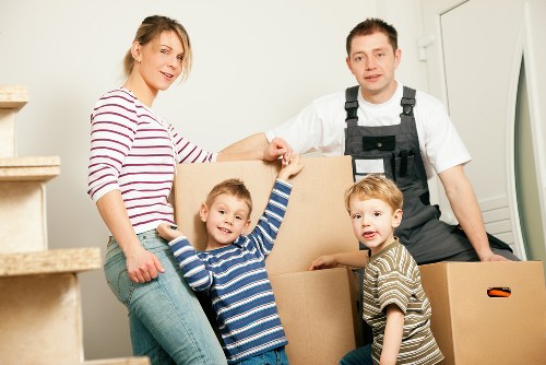 Professional movers handling furniture in a Harringay flat
