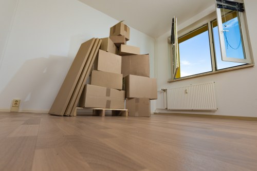 Moving van and team managing access for a flat removal on a North London street