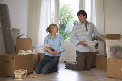 Professional movers handling office equipment during a Harringay relocation