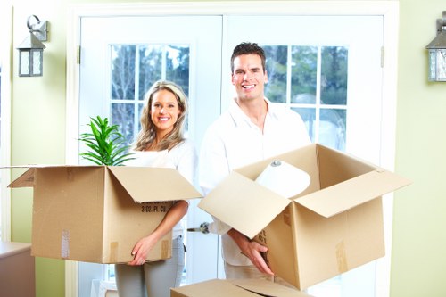 Removal van being loaded with protected furniture for transport